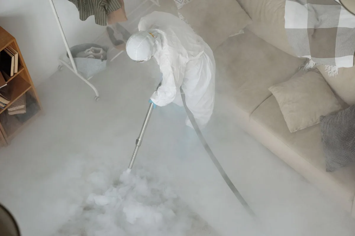 Biohazard cleanup technician in protective equipment, Hillburn, NY